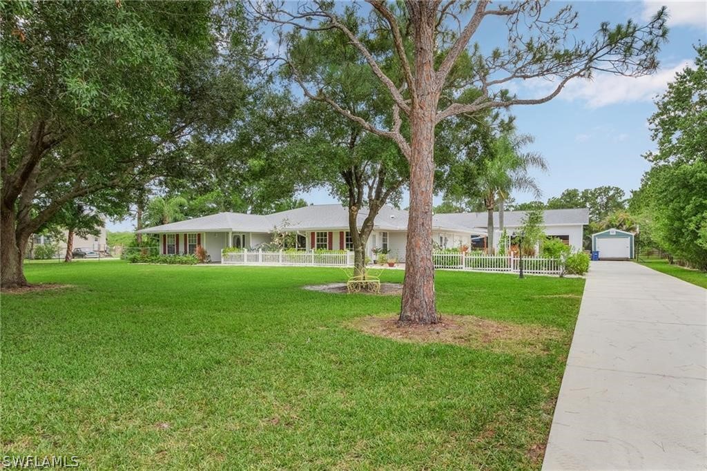 a view of a house with a yard