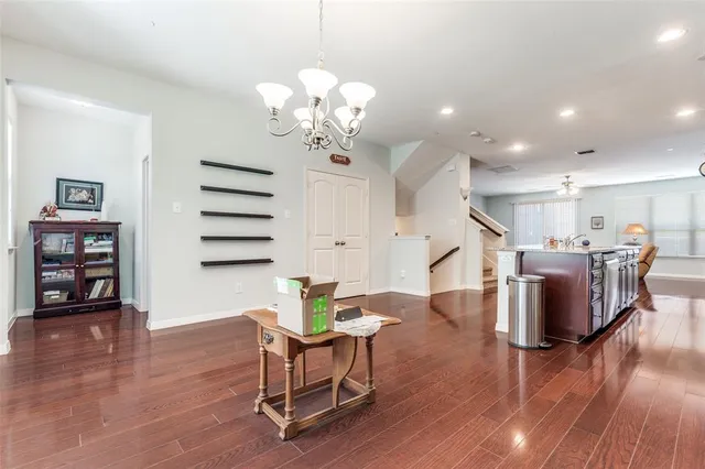 a view of a dining room with furniture and wooden floor