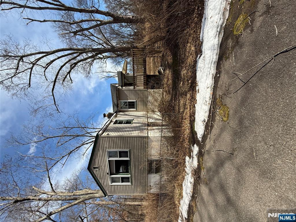 2 Brookside Road Wayne, NJ 07470 - Photo 1 of 2 a front view of a house with a yard