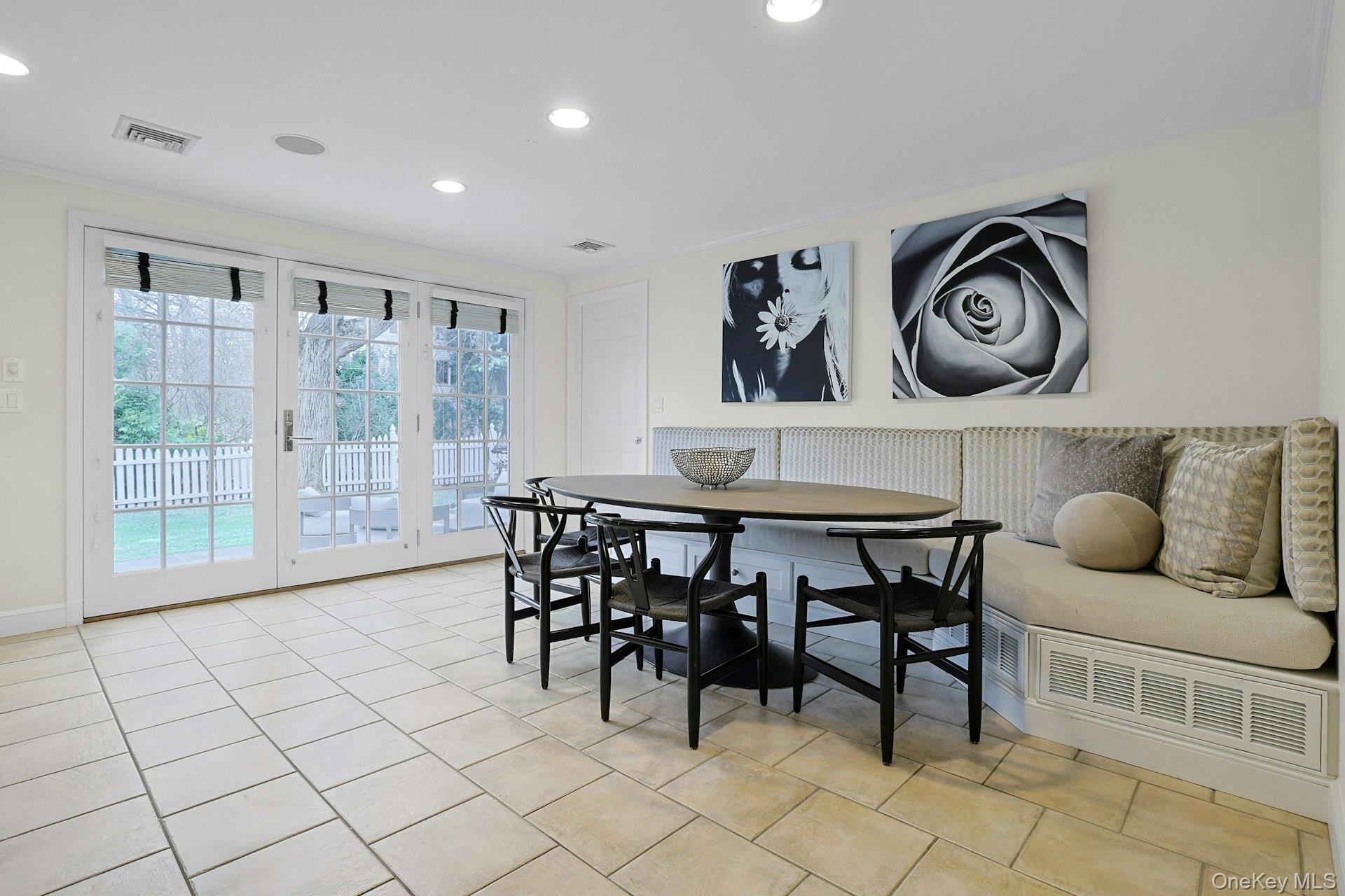 250 Mamaroneck Road Scarsdale, NY 10583 - Photo 14 of 35 Large dining area designed for comfortable daily use, featuring a view of the beautiful backyard.