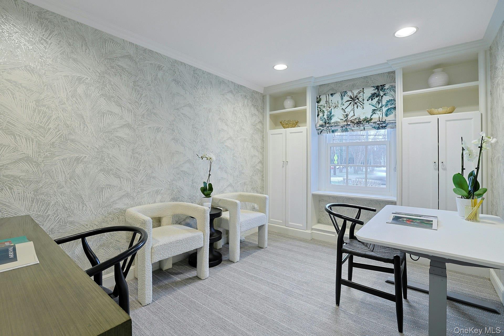 250 Mamaroneck Road Scarsdale, NY 10583 - Photo 15 of 35 Light filled and versatile, this thoughtfully designed space offers flexibility for a home office or creative retreat, enhanced by built in shelving and cabinetry, new wallpaper and shade (2022), and a view.