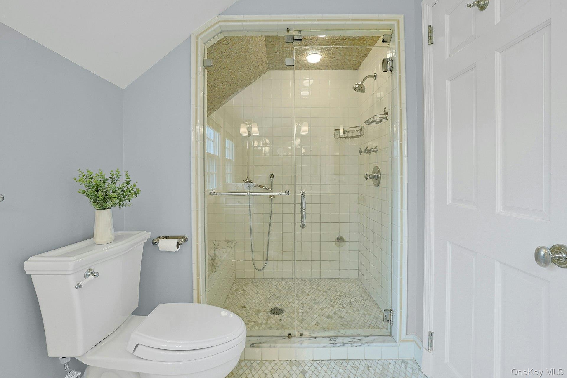 250 Mamaroneck Road Scarsdale, NY 10583 - Photo 20 of 35 Glass-enclosed primary ensuite steam shower, showcasing sleek tilework and a clean, modern finish.