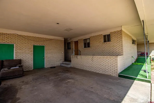 a view of a house with a yard and garage