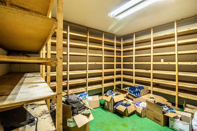 a kitchen with stainless steel appliances granite countertop a stove a sink dishwasher a refrigerator and a microwave oven