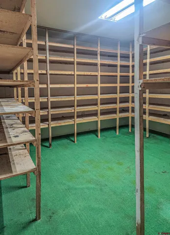 a view of a wooden deck and a yard