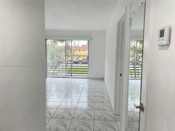 a view of an empty room with a window