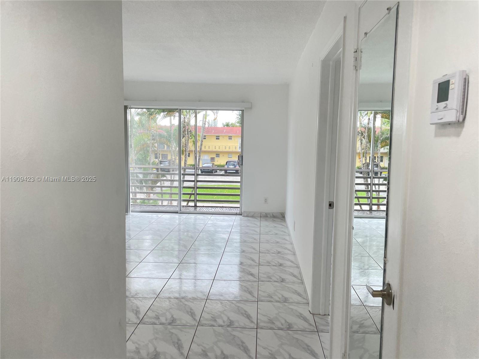 20201 Northeast 29th Court, Unit D221 Aventura, FL 33180 - Photo 4 of 13 a view of an empty room with a window