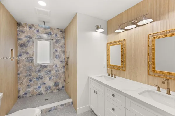 a bathroom with a shower sink and mirror