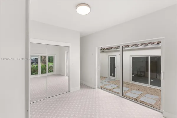 a view of a room with an empty room and window