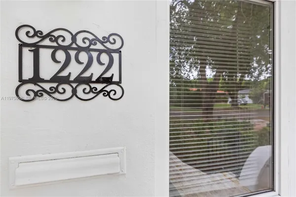 a view of a house with backyard and garden