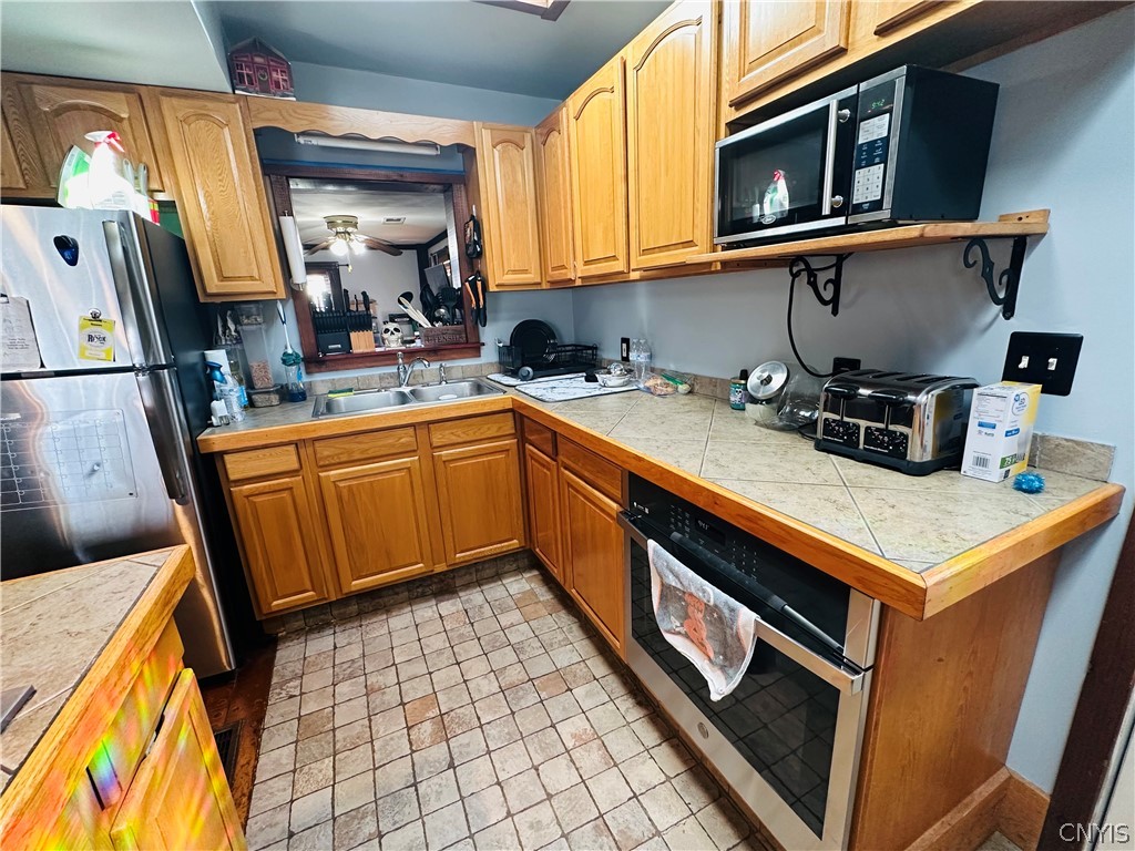 22 Scotch Hill Road Marcellus, NY 13108 - Photo 9 of 28 Kitchen w/solid surface counter tops, tile floor a