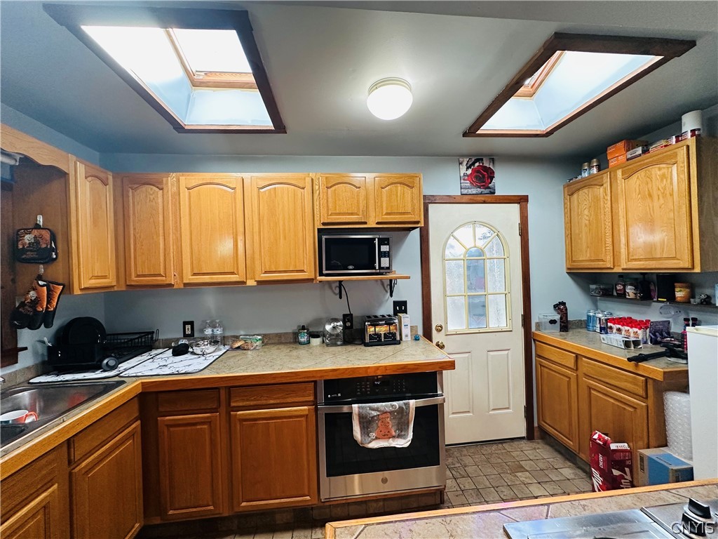 22 Scotch Hill Road Marcellus, NY 13108 - Photo 10 of 28 Skylights & side entry door to back deck.