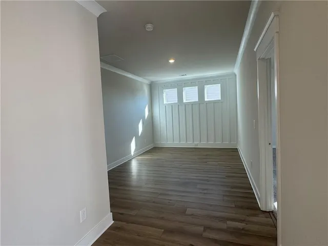 a view of gallery with wooden floor