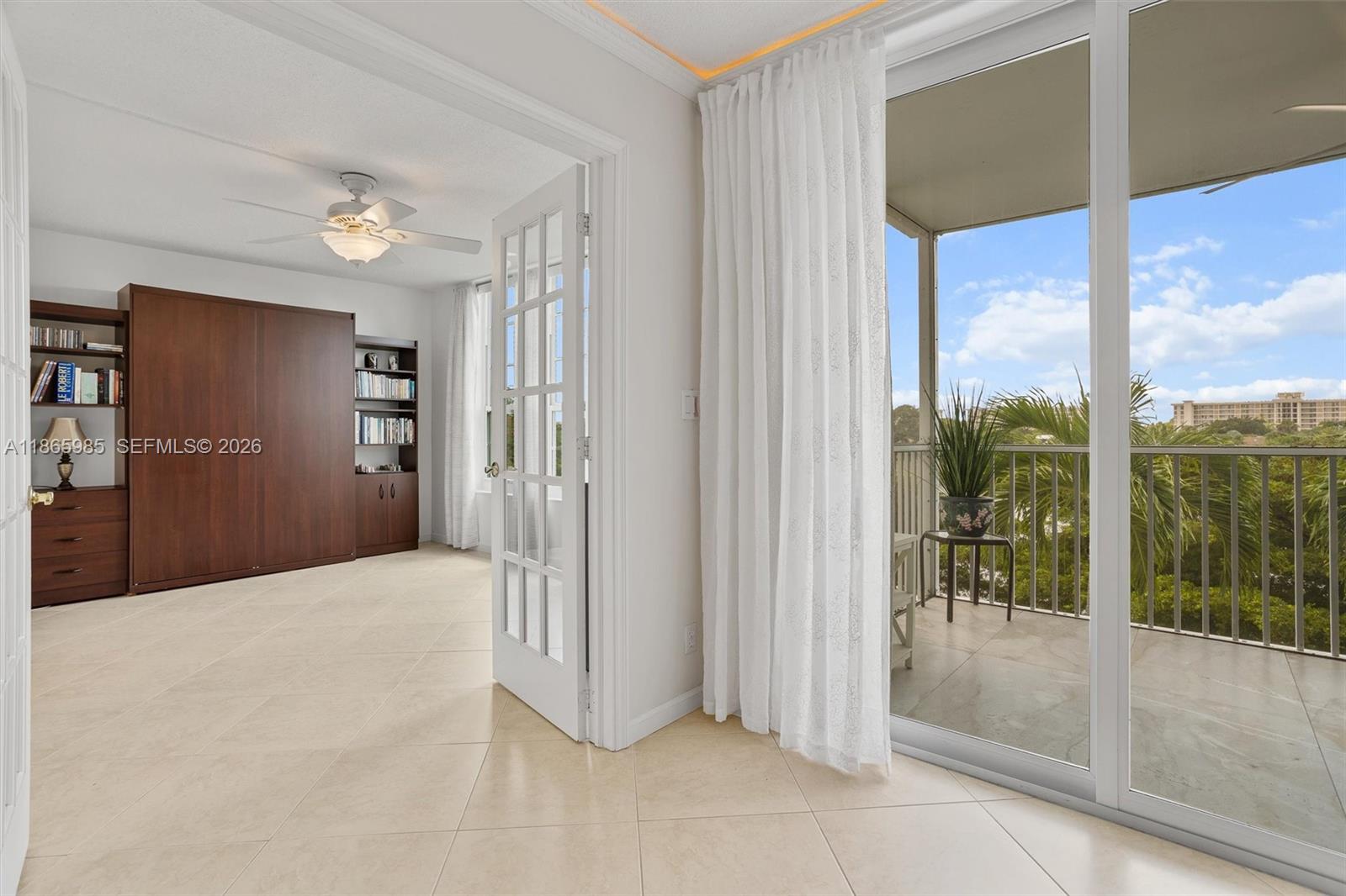 3150 North Course Lane, Unit 402 Pompano Beach, FL 33069 - Photo 13 of 29 a view of an empty room with glass windows