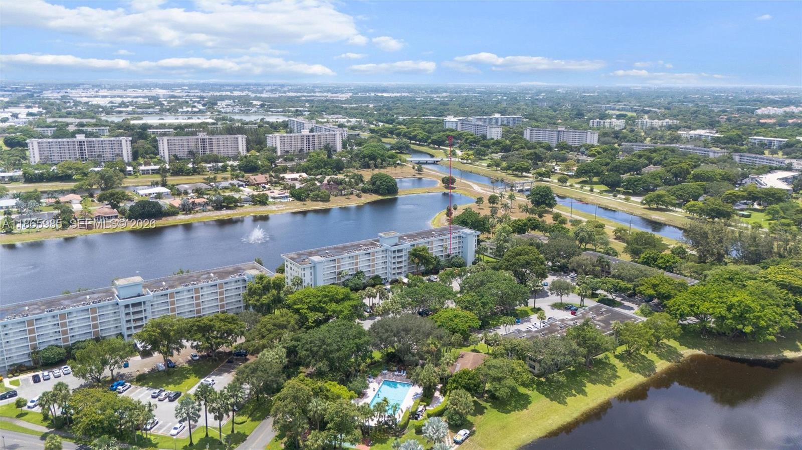 3150 North Course Lane, Unit 402 Pompano Beach, FL 33069 - Photo 25 of 29 an aerial view of residential building with outdoor space and lake view