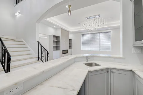 a view of a hallway with a chandelier
