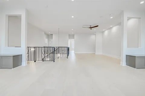 a view of kitchen with refrigerator and chairs