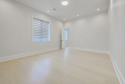 a bathroom with a shower sink and mirror