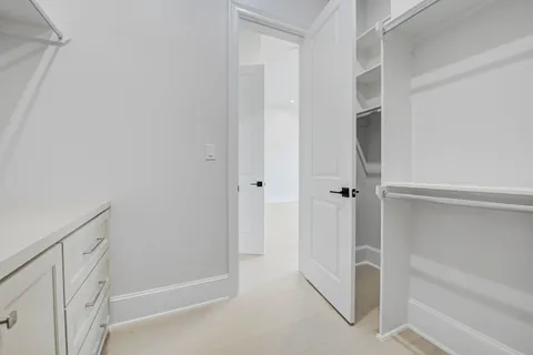 a bathroom with a shower sink and mirror
