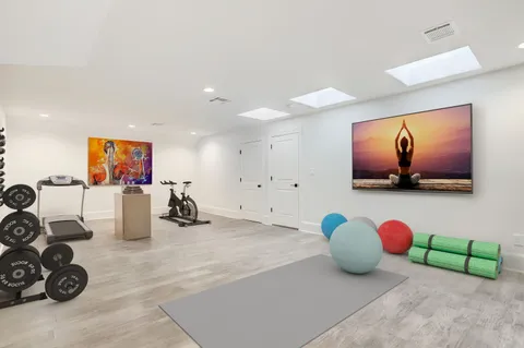 a view of a house with a yard and pathway