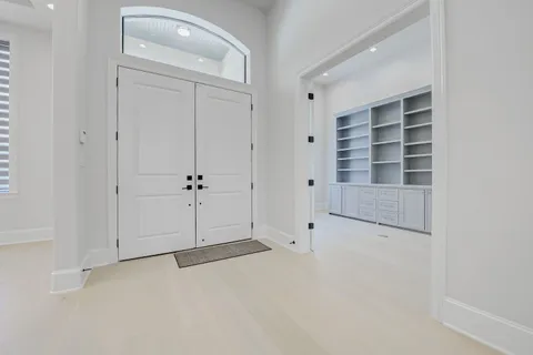 a view of entryway and hall with a window