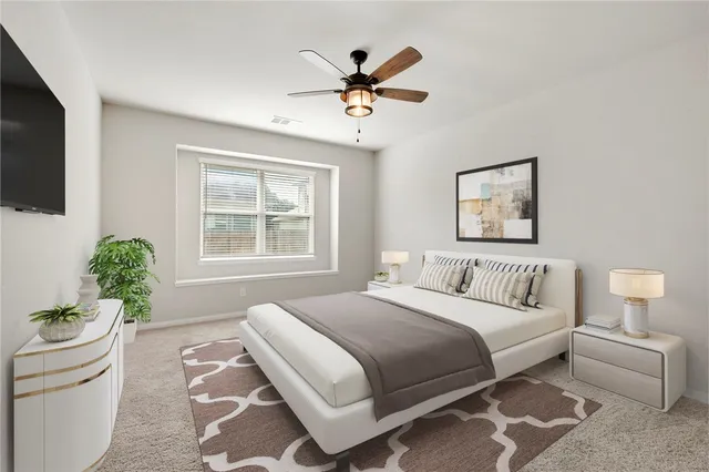 a bedroom with a bed and a window