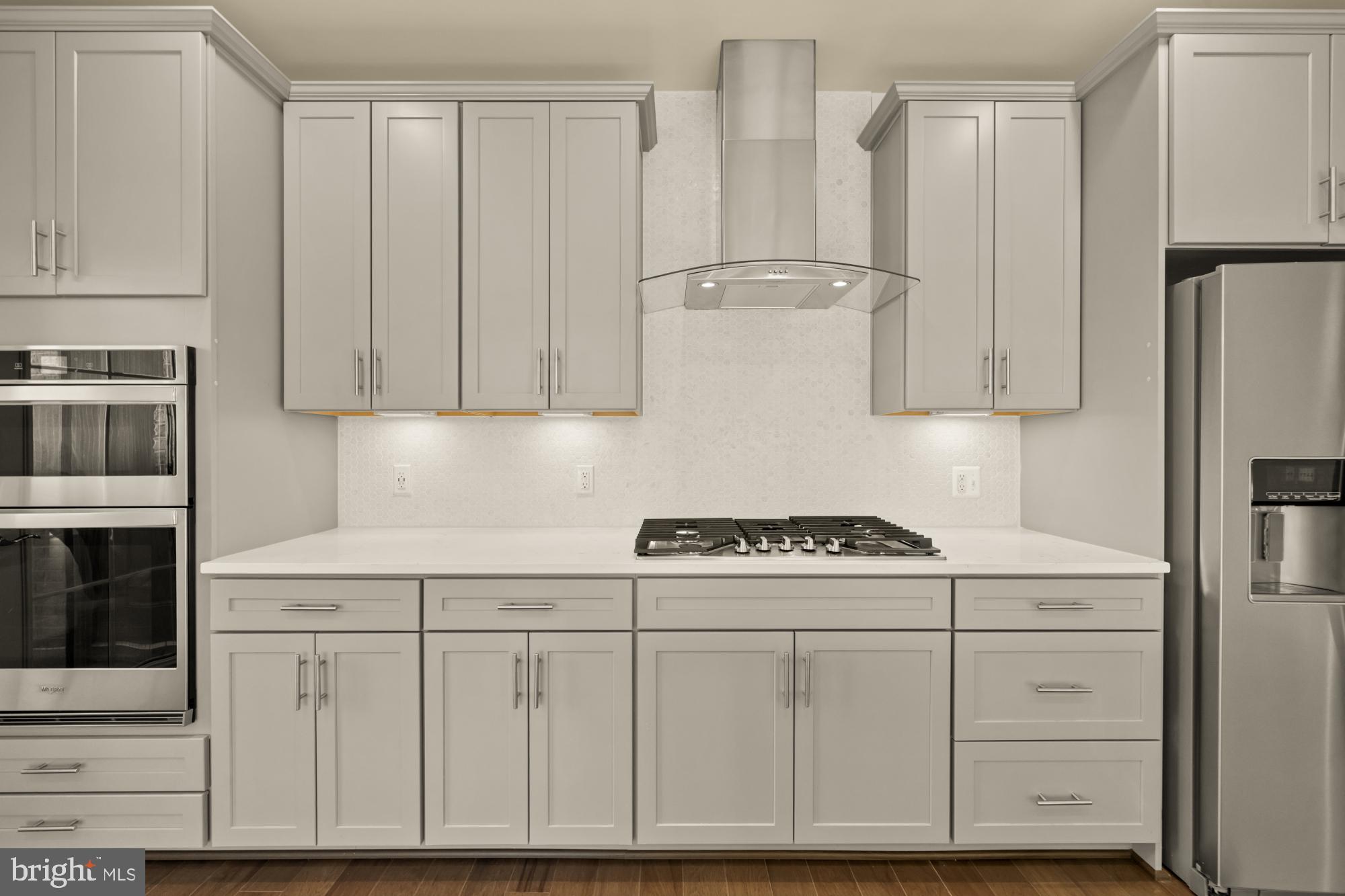 2320 Field Point Road, Unit 4304 Herndon, VA 20171 - Photo 11 of 43 a kitchen with white cabinets and white appliances