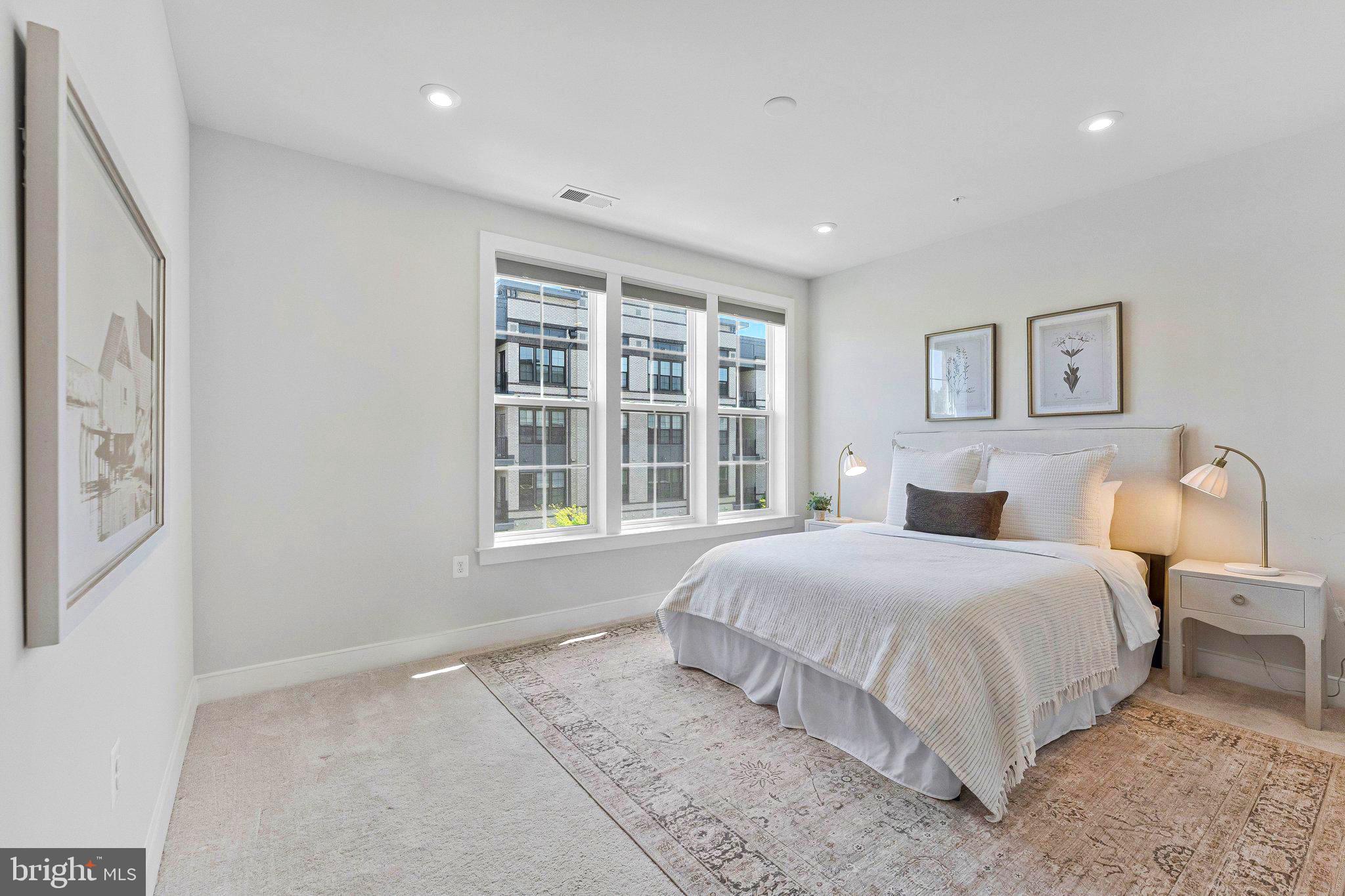 2320 Field Point Road, Unit 4304 Herndon, VA 20171 - Photo 13 of 42 a bedroom with a large bed and a window