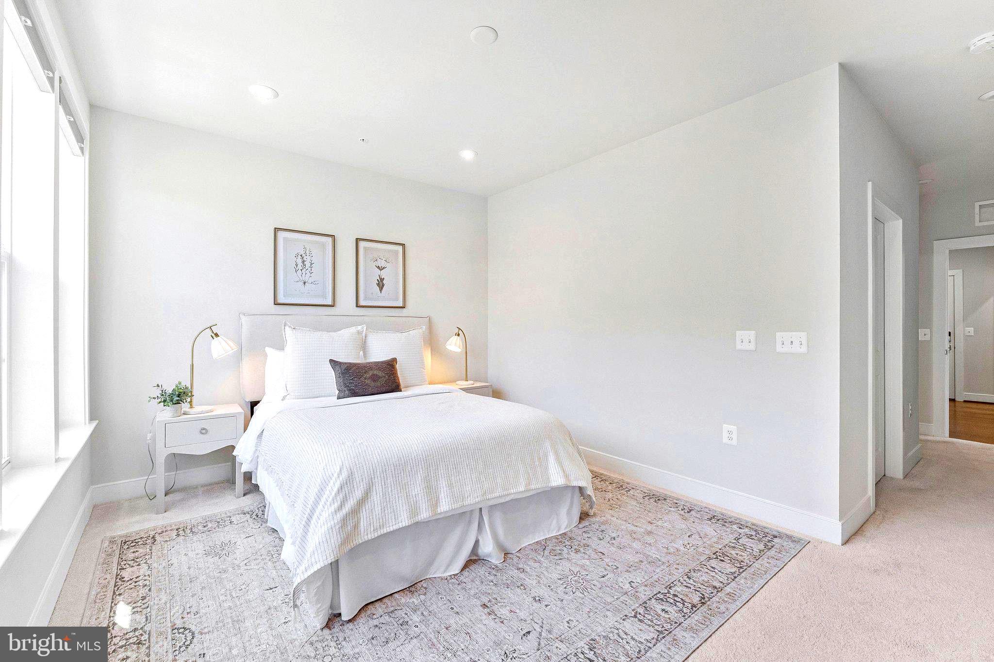 2320 Field Point Road, Unit 4304 Herndon, VA 20171 - Photo 14 of 42 a bedroom with a bed and a painting on the wall