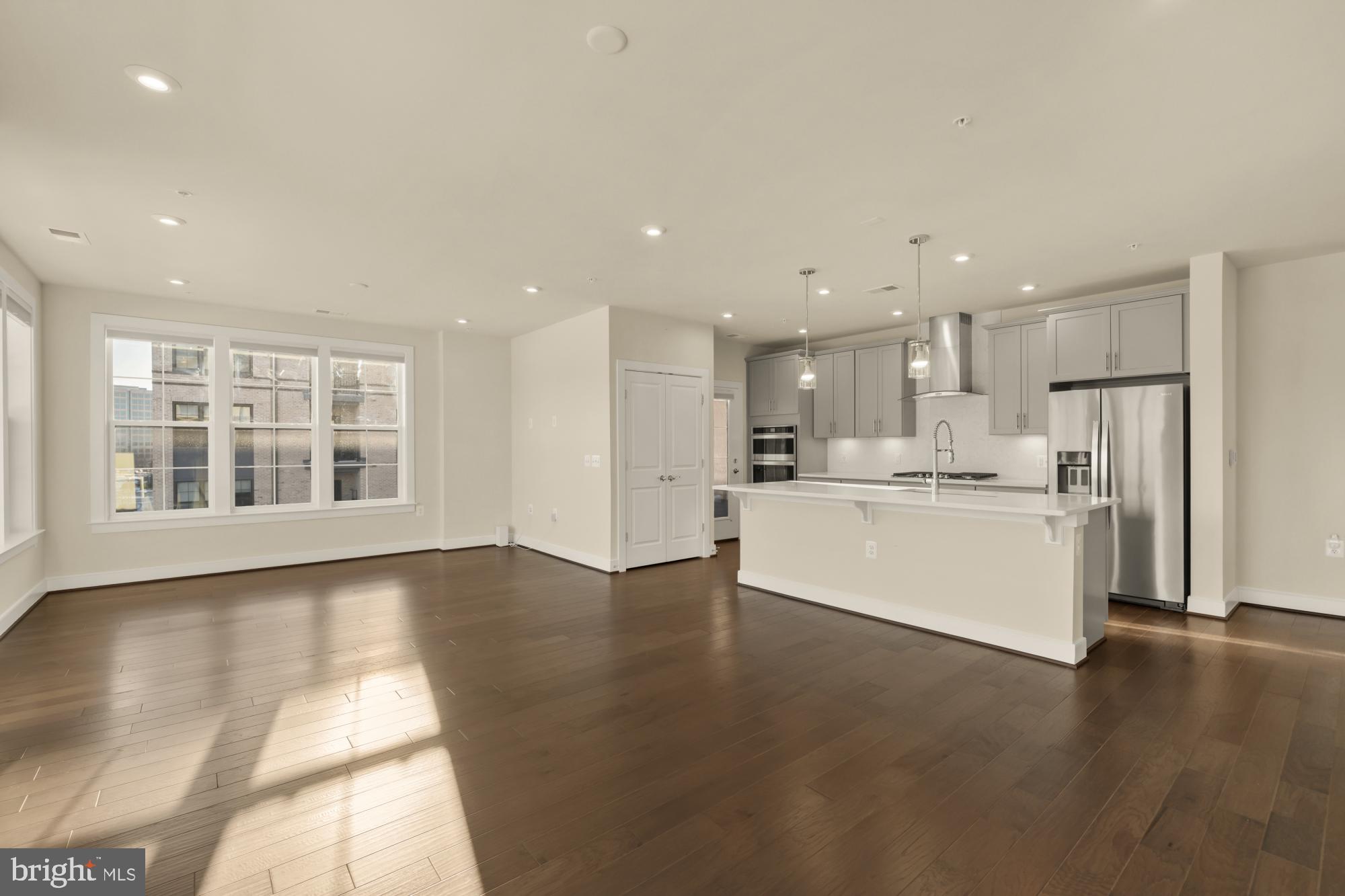 2320 Field Point Road, Unit 4304 Herndon, VA 20171 - Photo 16 of 43 a view of kitchen with kitchen island wooden floor center island and stainless steel appliances