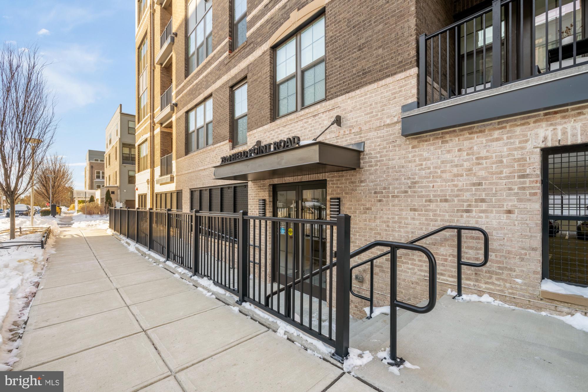 2320 Field Point Road, Unit 4304 Herndon, VA 20171 - Photo 2 of 43 a view of a building with a bench