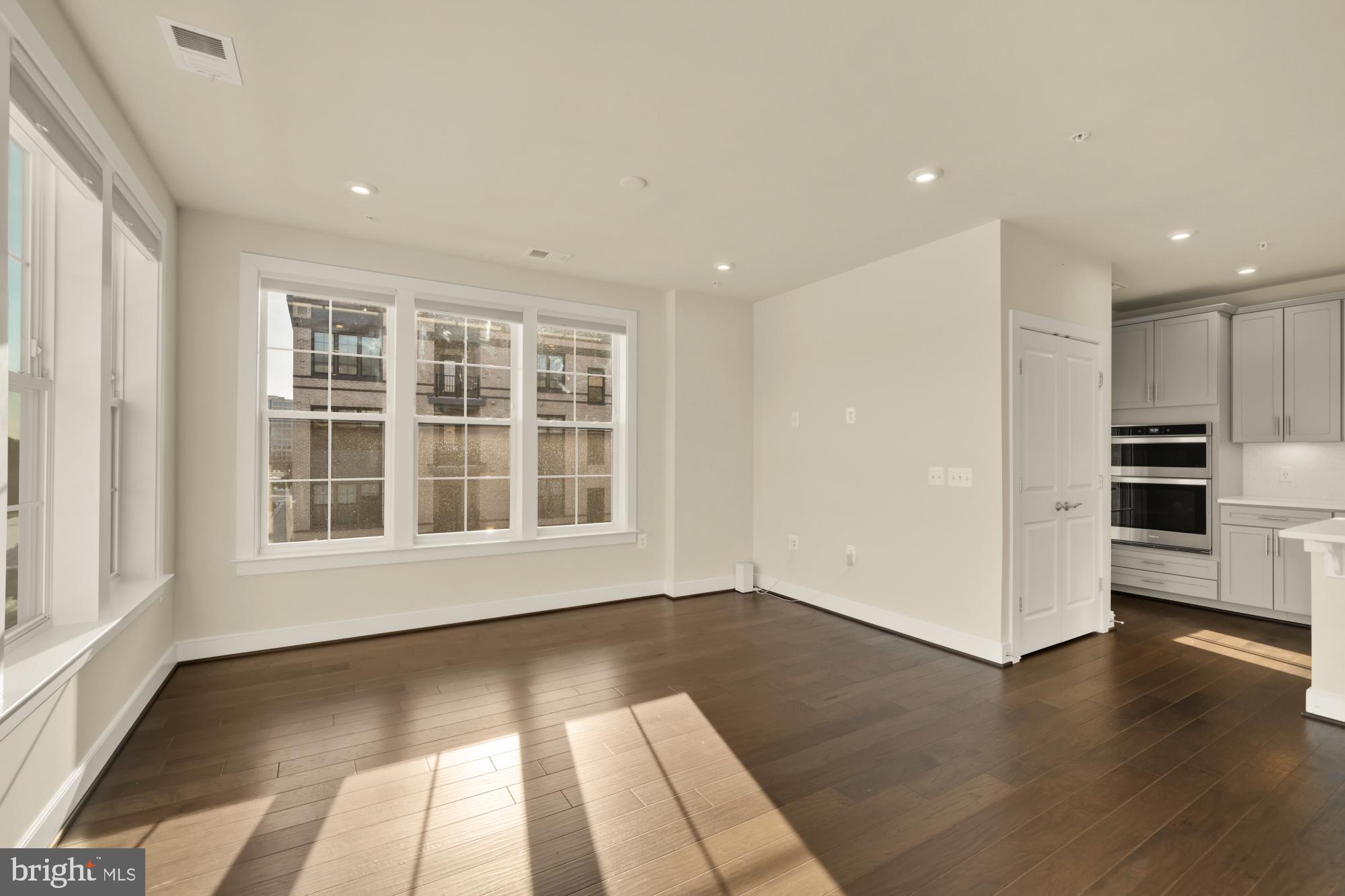 2320 Field Point Road, Unit 4304 Herndon, VA 20171 - Photo 21 of 43 a view of an empty room with a window and wooden floor