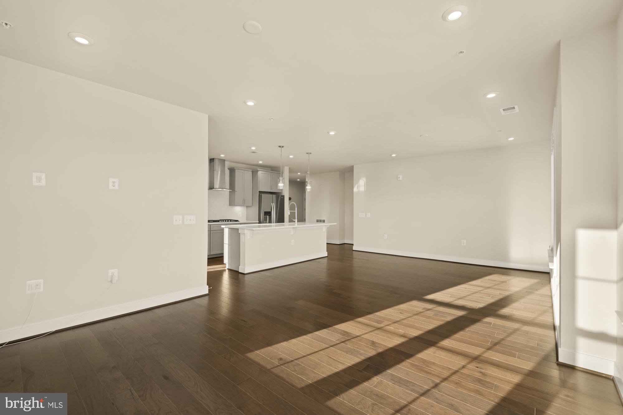 2320 Field Point Road, Unit 4304 Herndon, VA 20171 - Photo 22 of 43 a view of kitchen and hall with wooden floor