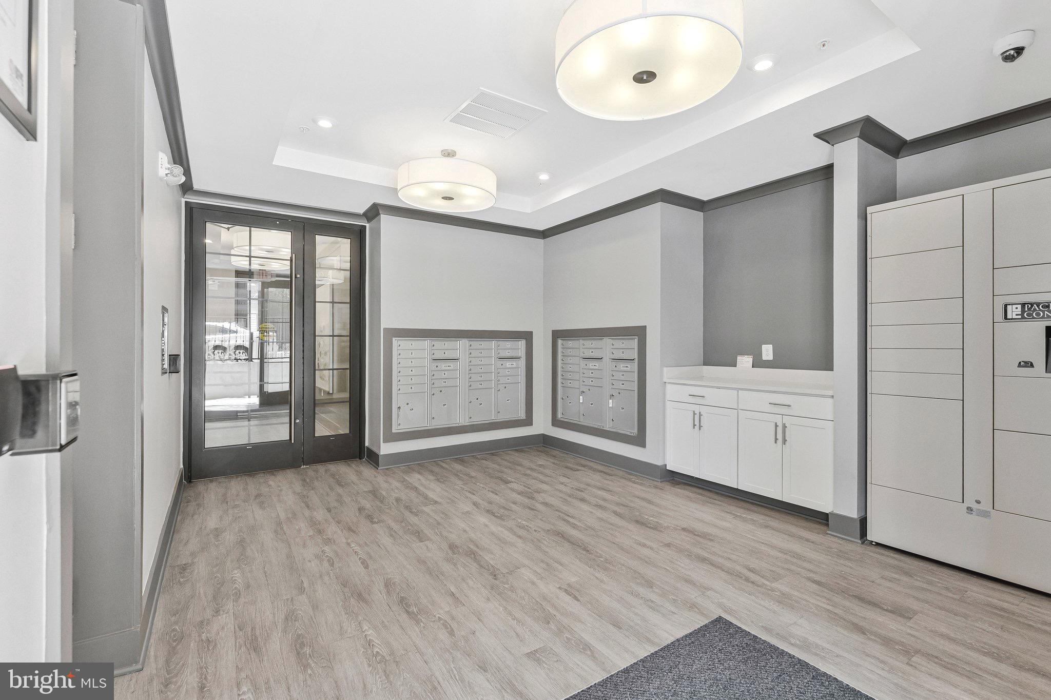 2320 Field Point Road, Unit 4304 Herndon, VA 20171 - Photo 26 of 42 a view of a kitchen with white cabinets and wooden floor
