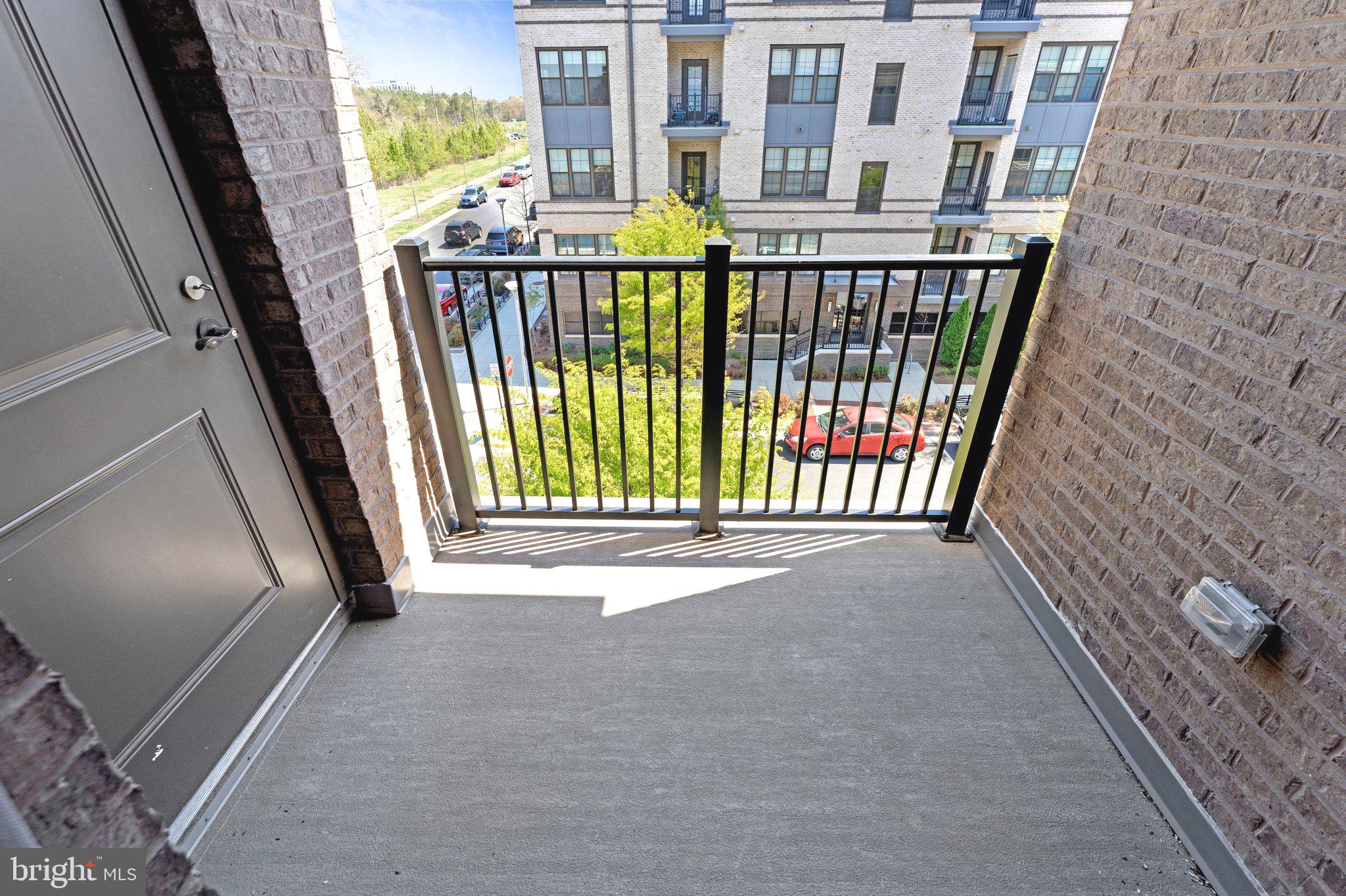 2320 Field Point Road, Unit 4304 Herndon, VA 20171 - Photo 29 of 42 a view of a balcony with an outdoor space