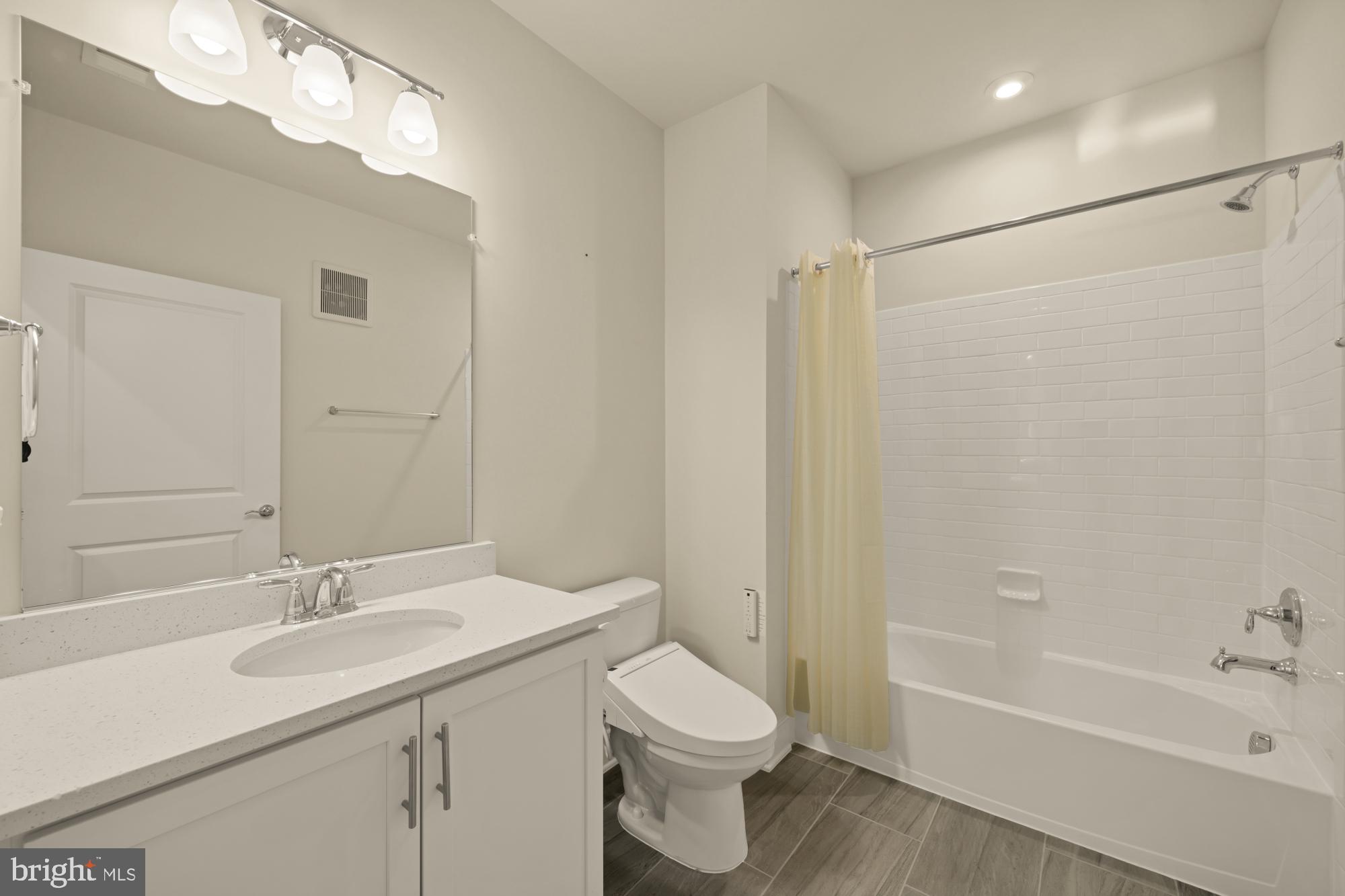 2320 Field Point Road, Unit 4304 Herndon, VA 20171 - Photo 32 of 43 a bathroom with a sink a toilet and shower