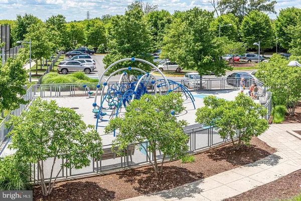 a view of backyard with swimming pool and seating