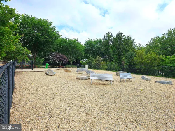 a view of a swimming pool with a patio and yard of the back