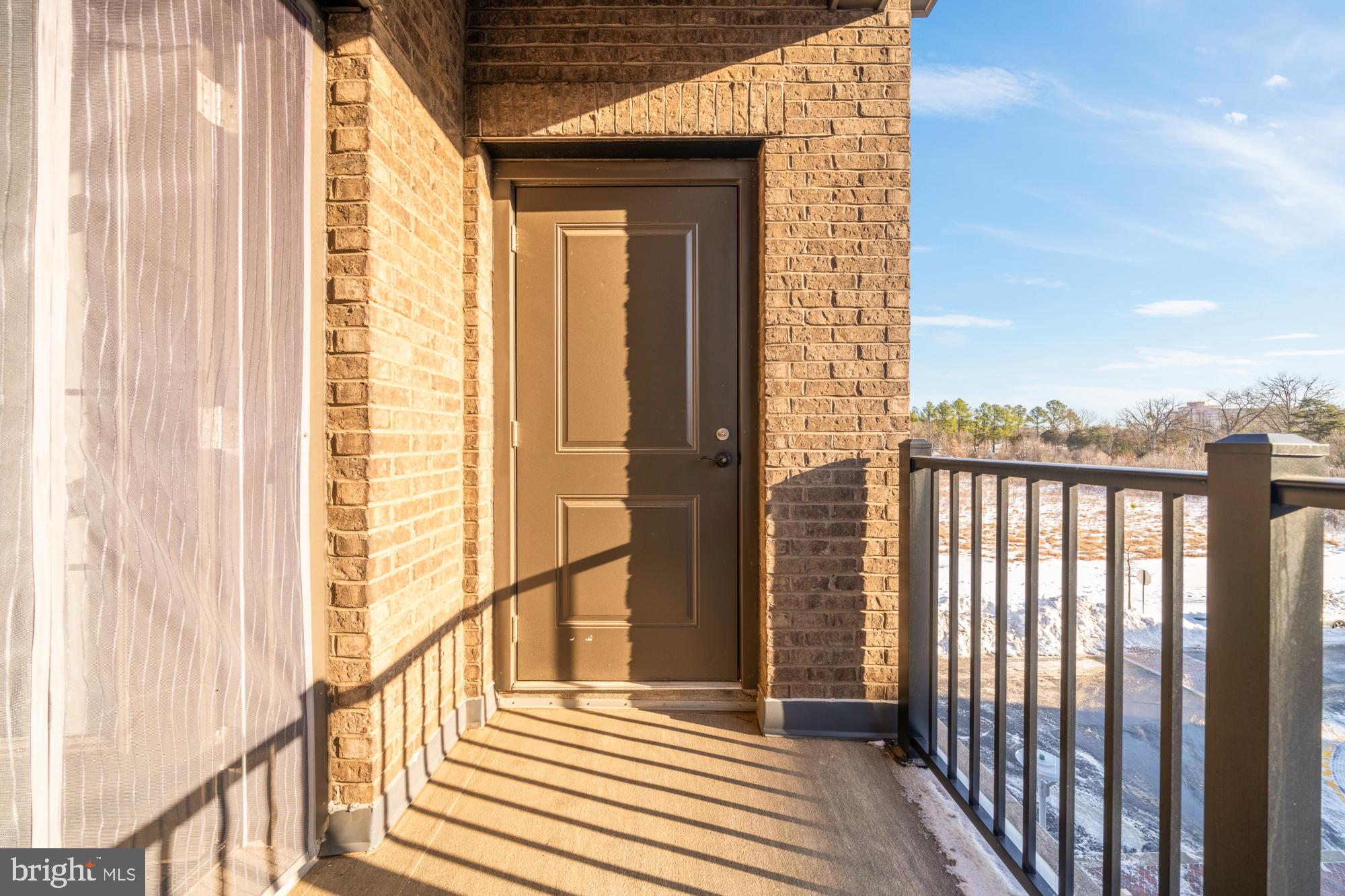 2320 Field Point Road, Unit 4304 Herndon, VA 20171 - Photo 36 of 43 a view of a balcony with wooden floor and fence