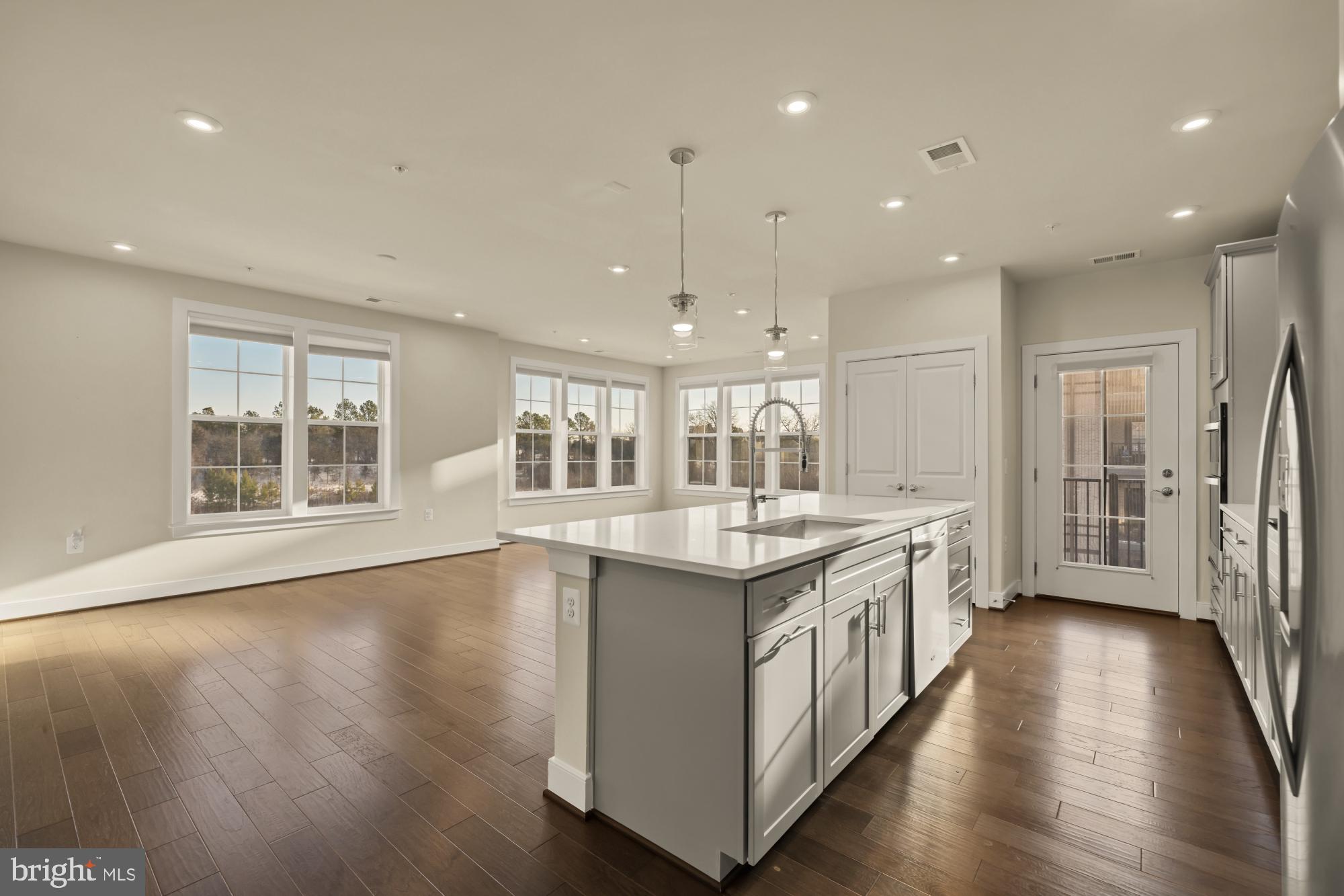 2320 Field Point Road, Unit 4304 Herndon, VA 20171 - Photo 5 of 43 a kitchen with a sink and wooden floor