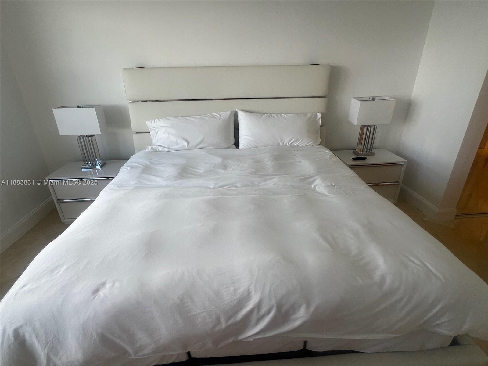 100 Lincoln Road, Unit 848 Miami Beach, FL 33139 - Photo 18 of 68 a large white bed sitting in a bedroom