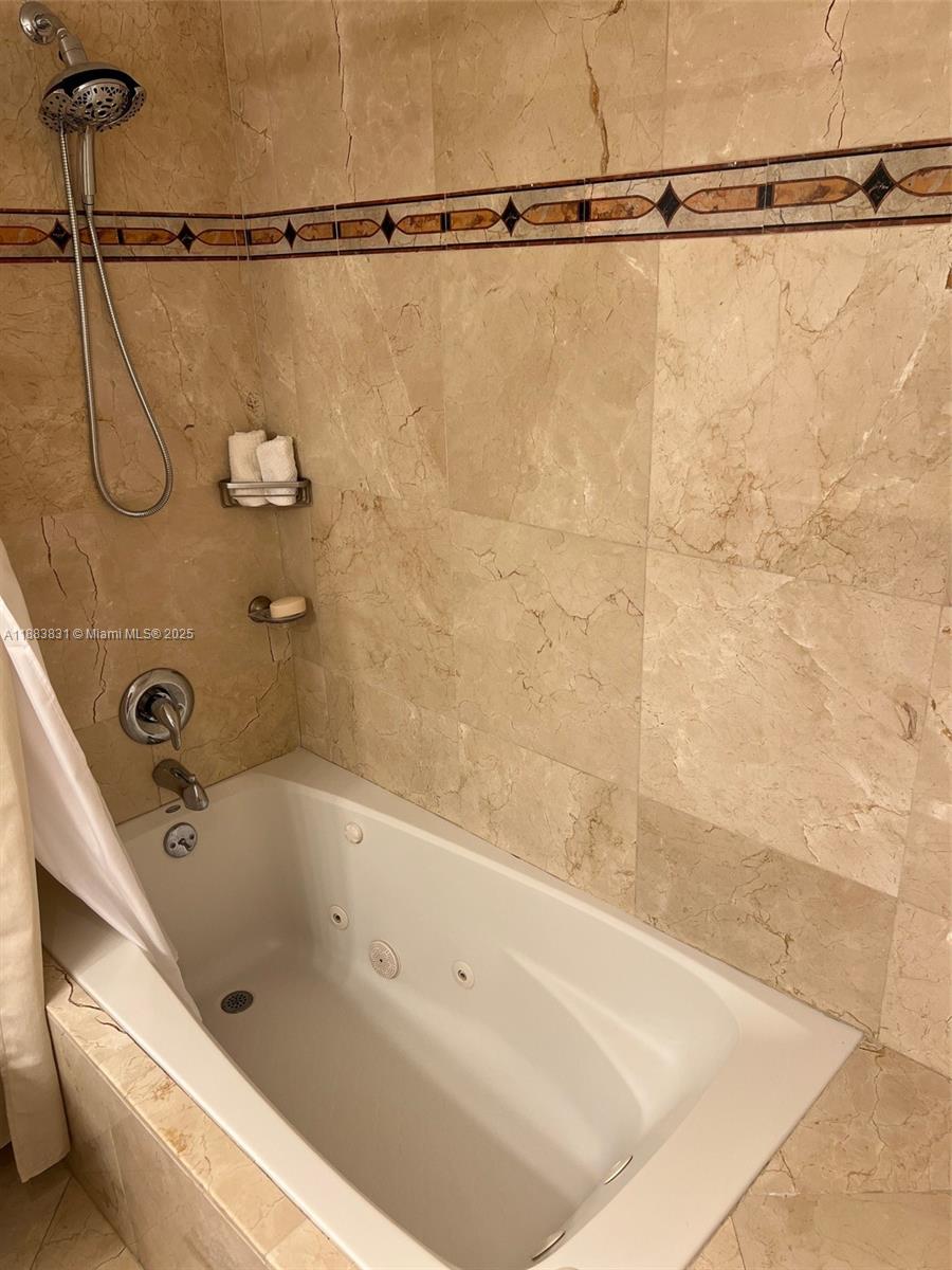 100 Lincoln Road, Unit 848 Miami Beach, FL 33139 - Photo 23 of 68 a bathroom with a bathtub and a shower