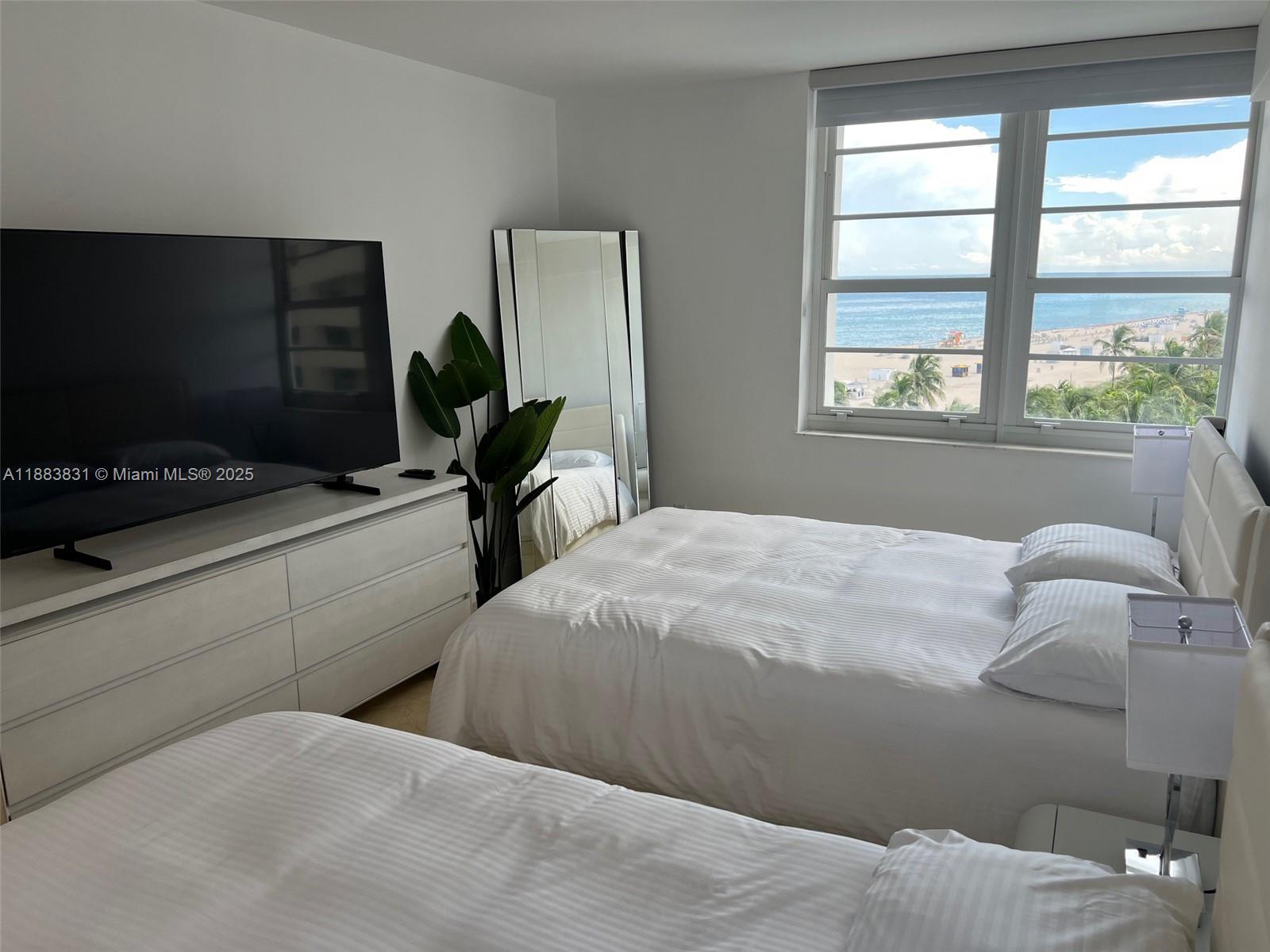 100 Lincoln Road, Unit 848 Miami Beach, FL 33139 - Photo 28 of 68 a bedroom with a bed and a window