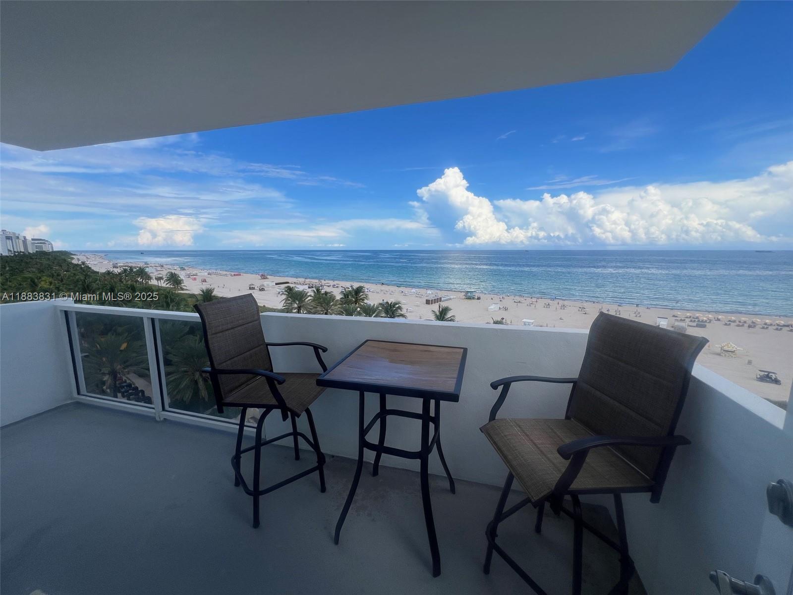 100 Lincoln Road, Unit 848 Miami Beach, FL 33139 - Photo 6 of 68 a view of a dining room with furniture and wooden floor