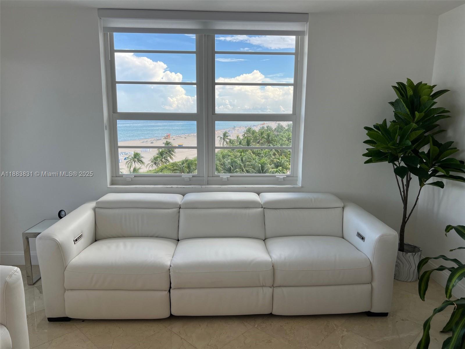 100 Lincoln Road, Unit 848 Miami Beach, FL 33139 - Photo 9 of 68 a living room with furniture and a potted plant