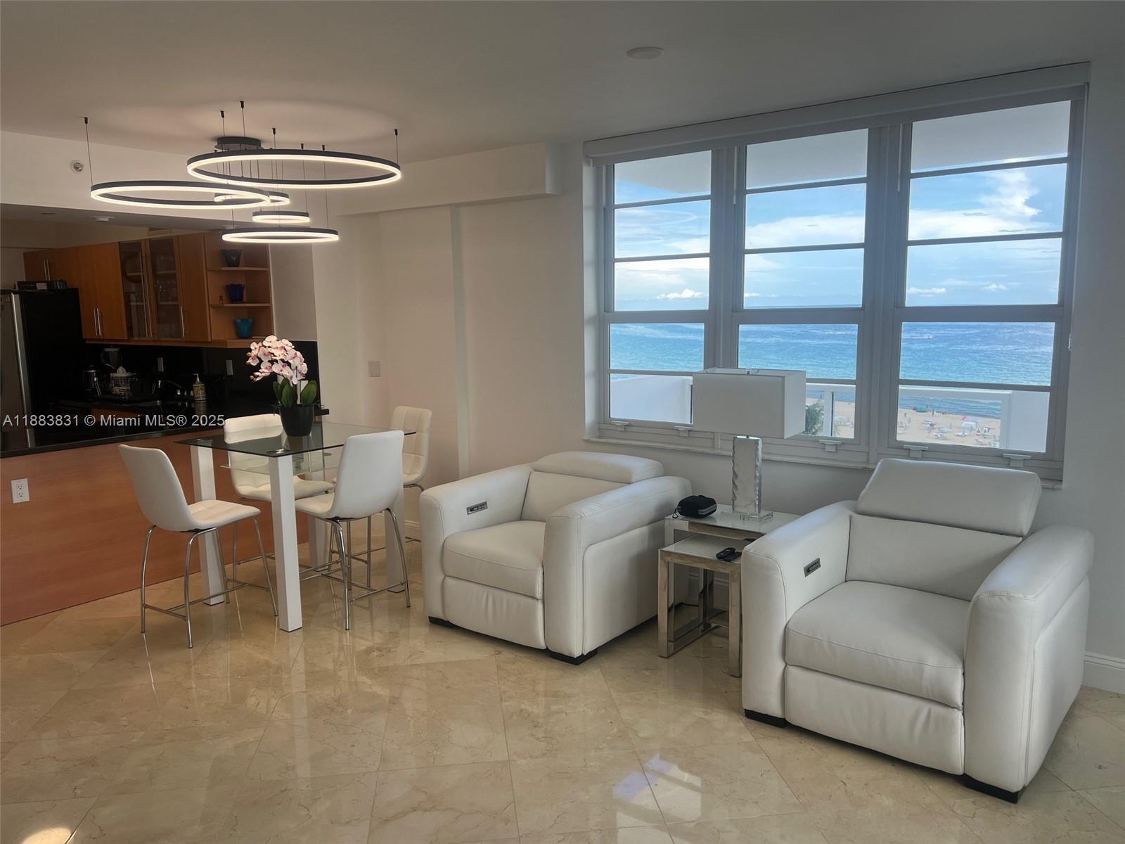 100 Lincoln Road, Unit 848 Miami Beach, FL 33139 - Photo 10 of 68 a living room with furniture and a large window