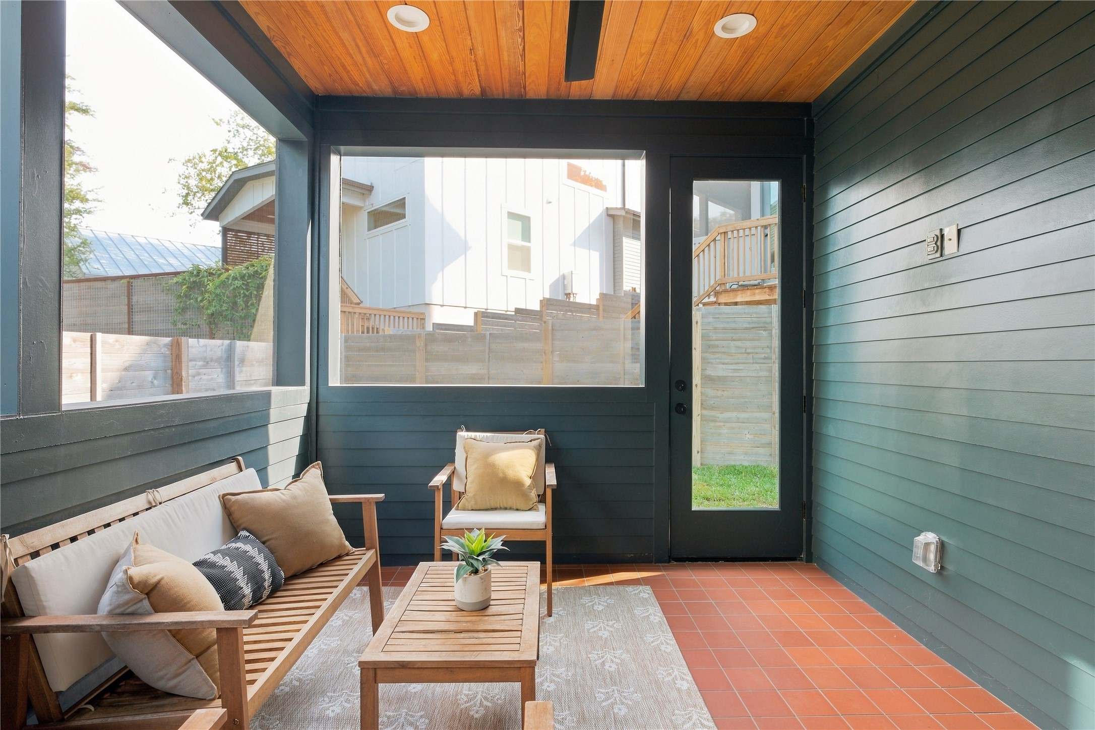 5506 Hudson Street, Unit 2 Austin, TX 78721 - Photo 7 of 24 Natural wood plank ceilings and warm terra cotta tile define this covered outdoor porch.