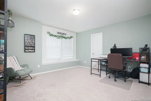 a workspace with furniture and a window