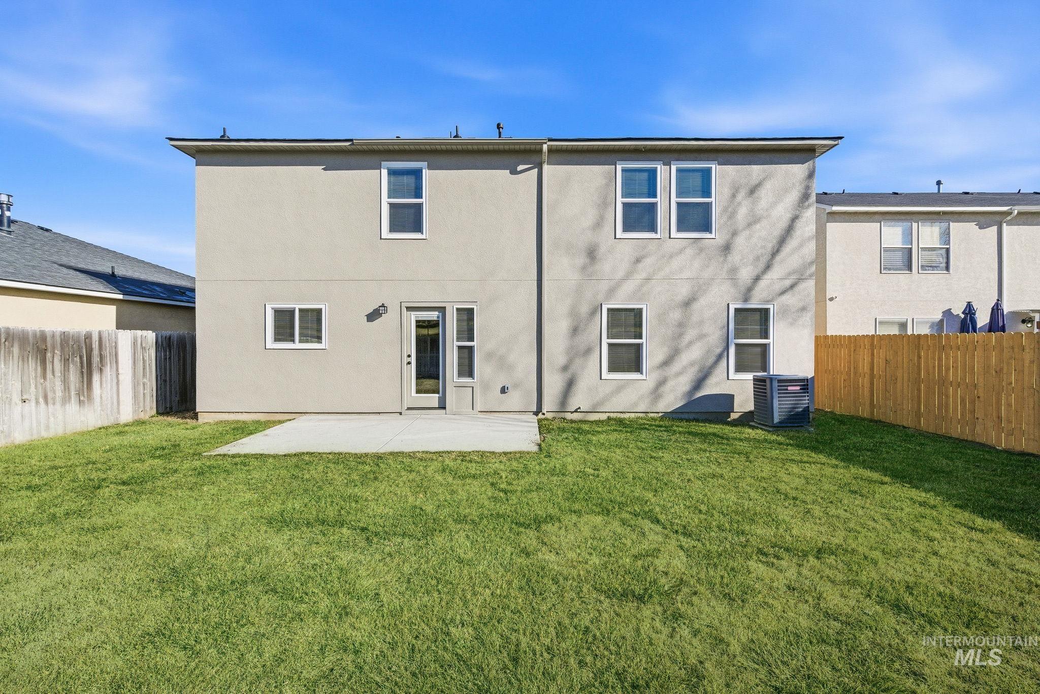 3312 Vistapark Drive Caldwell, ID 83605 - Photo 17 of 17 Rear view of house featuring a patio, a fenced backyard, and stucco siding