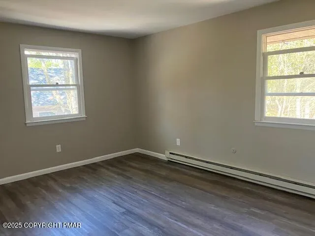 a bathroom with a granite countertop toilet and a sink